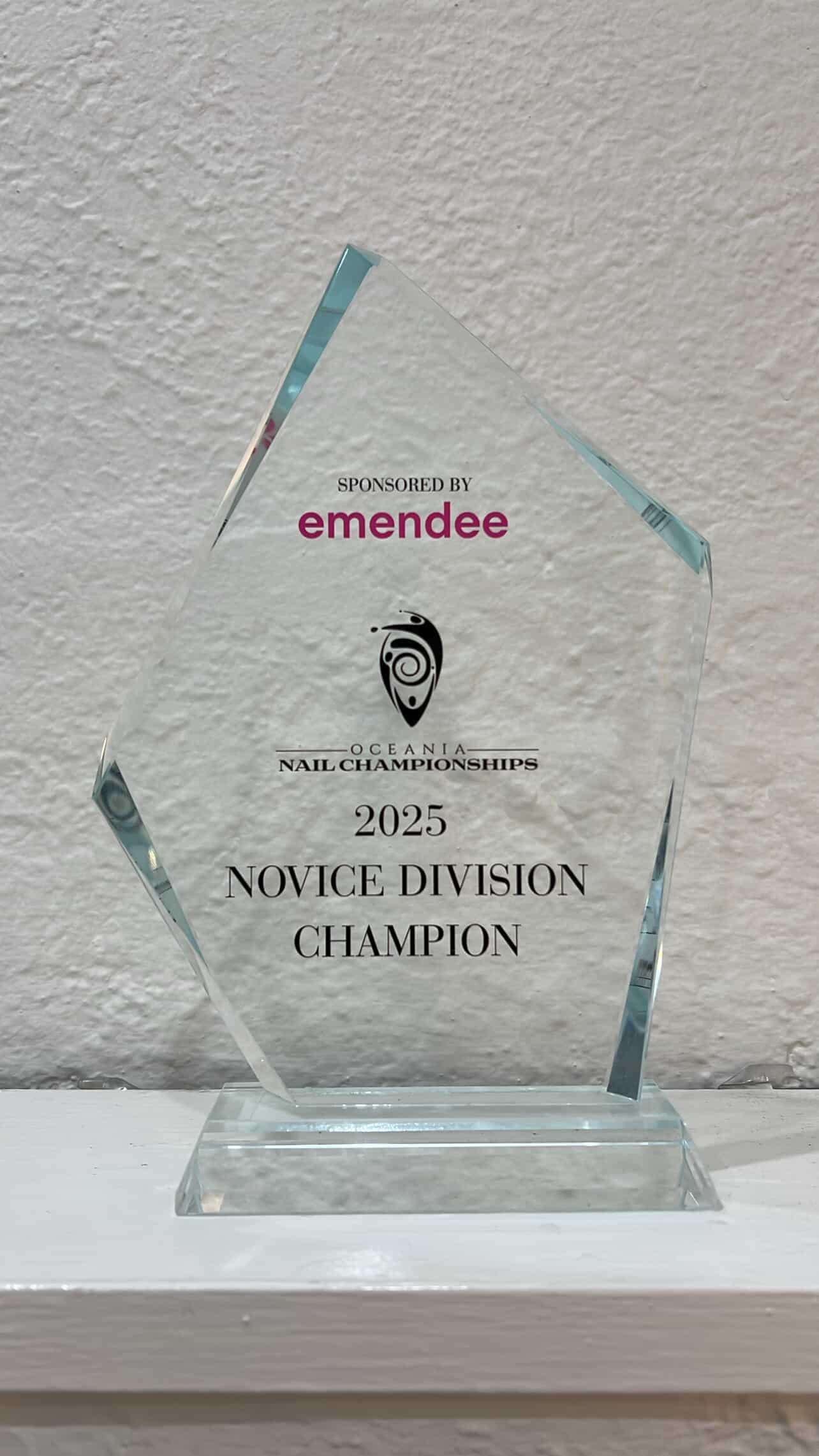 Oceania Nail Championships 2025 Novice Division Champion glass trophy sponsored by Emendee.